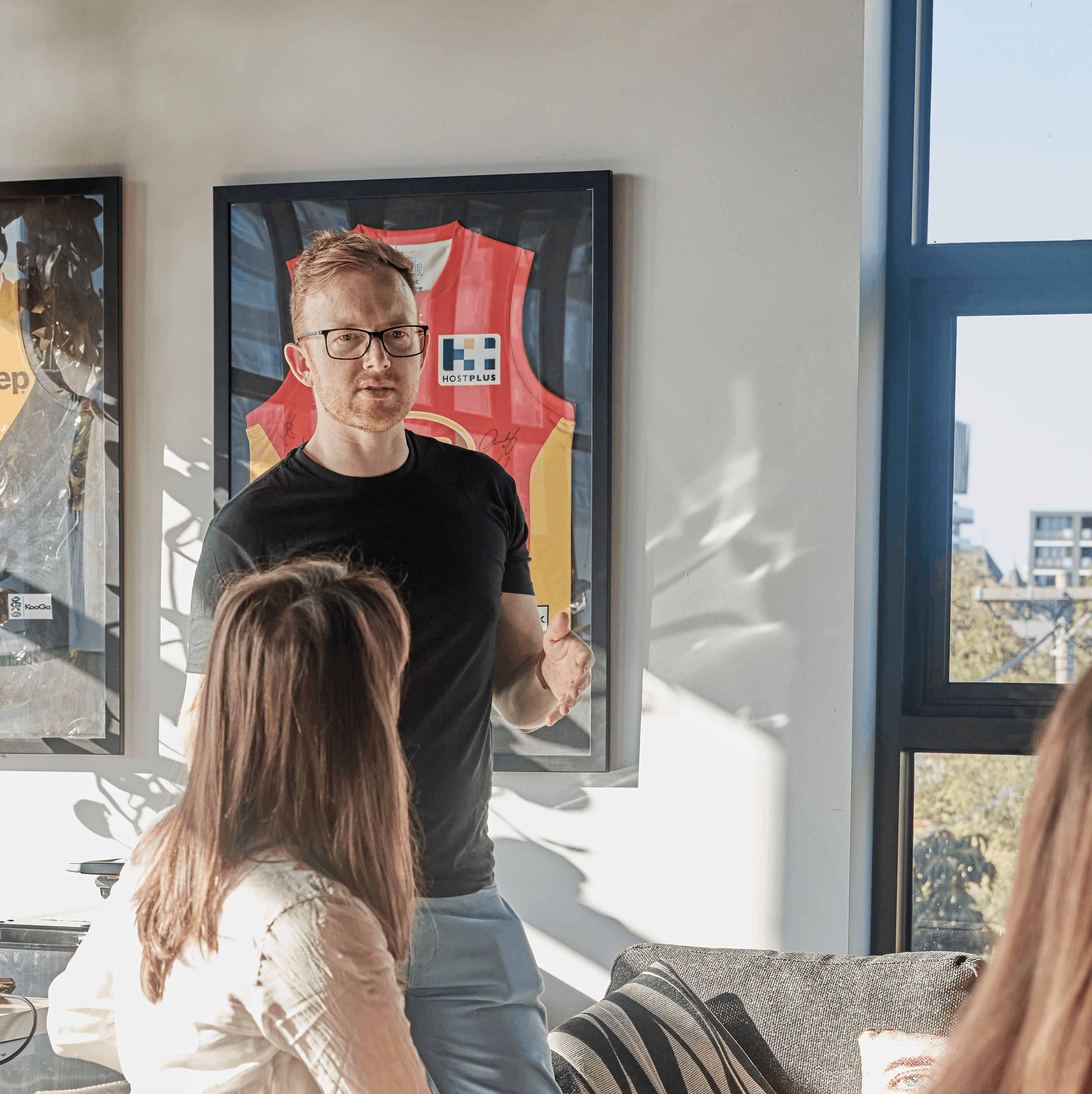 Jim Ferguson talking through a problem with colleagues in the office